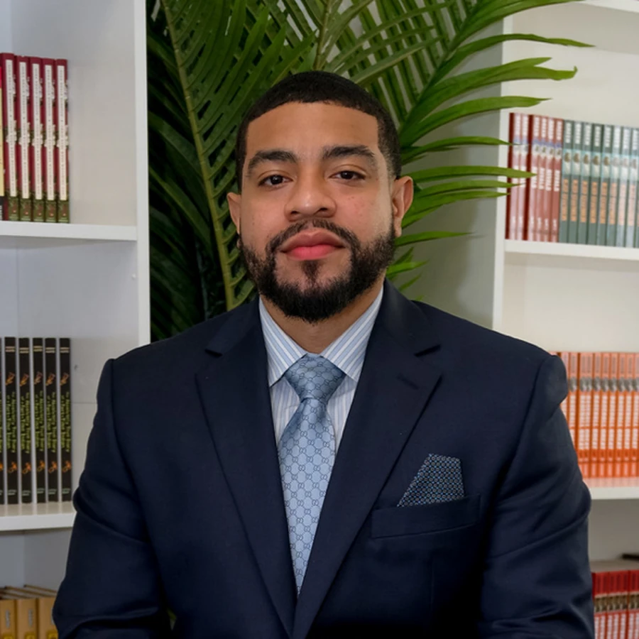 Portrait of Anthony Morris, founder and head therapist of Klutch Therapy, in a navy suit